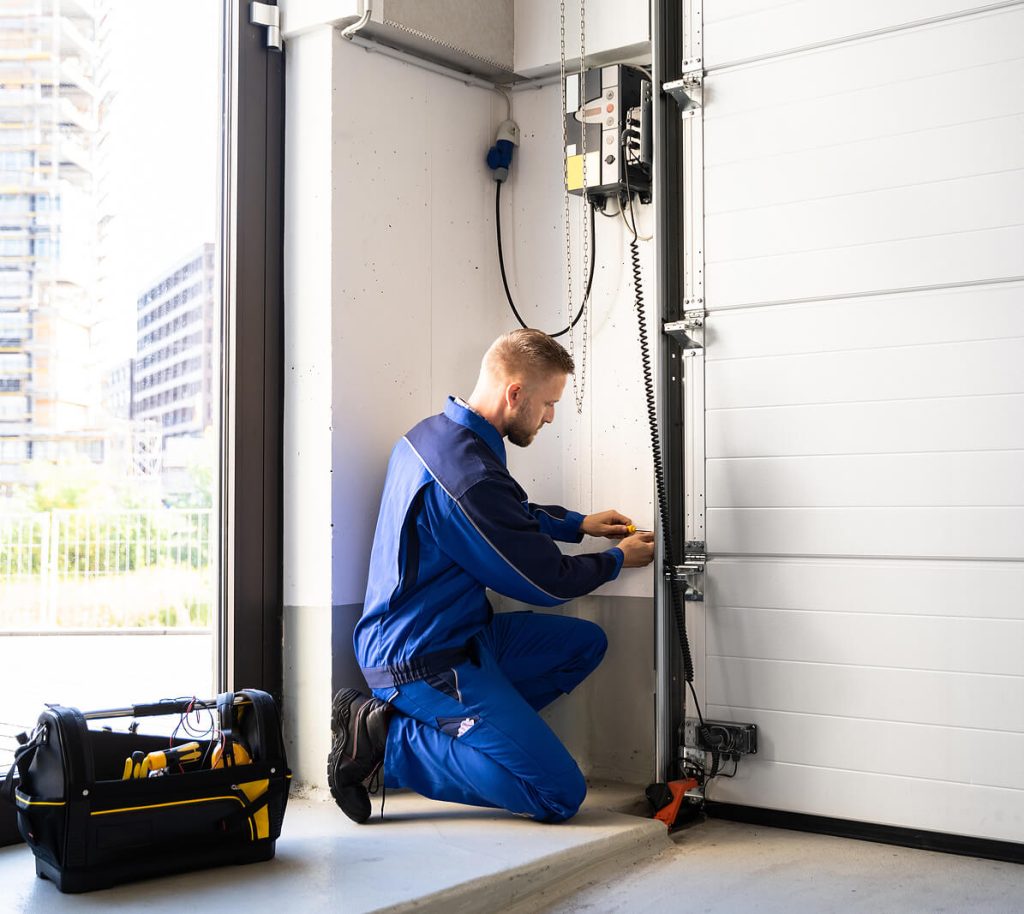 MAN FIXING GARAGE DOOR